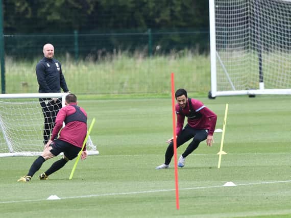 Dwight McNeil under the watchful eye of Sean Dyche. Picture: Andy Ford/Burnley FC