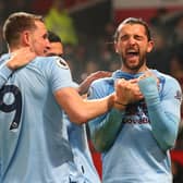 Jay Rodriguez of Burnley celebrates with Chris Wood and teammates after scoring his sides second goal during the Premier League match between Manchester United and Burnley FC at Old Trafford on January 22, 2020 in Manchester, United Kingdom. (Photo by Alex Livesey/Getty Images)