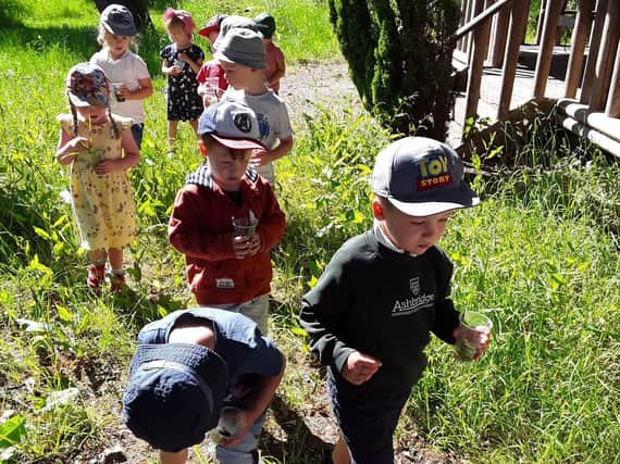 Social distance playing in Badgers Wood at Ashbridge School and  Nursery