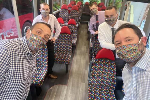 Transdev operations director Vitto Pizzuti (front left) and chief executive Alex Hornby (front right) with Transdevs team sporting the bus firms specially designed face coverings in the colours of each of its companies across the North