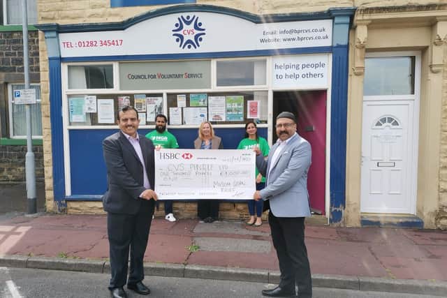 Mr Mujahaid Bin Jamshaid, MGR head of Digital Advertising and Communication, Mrs Christine Blythe, BPRCVS chief officer, and Ms Asma Siddique, MGR charity manager, (back)
Coun. Mohammed Iqbal, leader of Pendle Council, and Mr Mohammad Razaque, MGR director, (front).