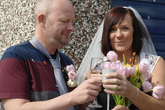 Susan and Dave toast each other on their surprise lockdown 'wedding' day organised by neighbours