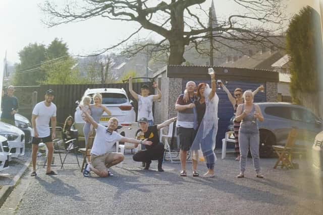 The happy couple toast their neighbours who organised their surprise lockdown 'wedding'
