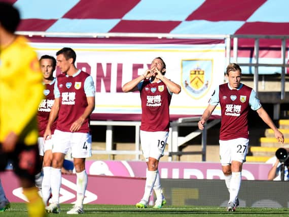 Burnley's English striker Jay Rodriguez ( 2nd - R ) celebrates scoring his team's first goal during the English Premier League football match between Burnley and and Watford at Turf Moor in Burnley, north west England on June 25, 2020. (Photo by PETER POWELL / POOL / AFP)