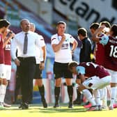 Sean Dyche and his players during a drink break against Watford
