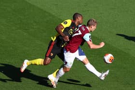 Matej Vydra of Burnley and Christian Kabasele of Watford battle for possession during the Premier League match between Burnley FC and Watford FC at Turf Moor on June 25