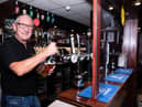 Ighten Leigh Social Club steward Brian Parker is back behind the bar ready for Saturday's reopening. Photo: Kelvin Stuttard