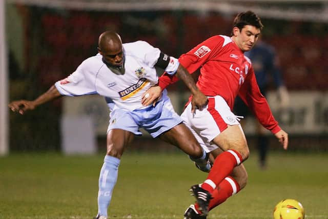 Frank Sinclair of Burnley tackles Andy Whyte of Crewe Alexandra during the Coca-Cola Football League Championship match between Crewe Alexandra and Burnley at Alexandra Stadium on February 15, 2005 in Crewe, England. (Photo by Bryn Lennon/Getty Images)