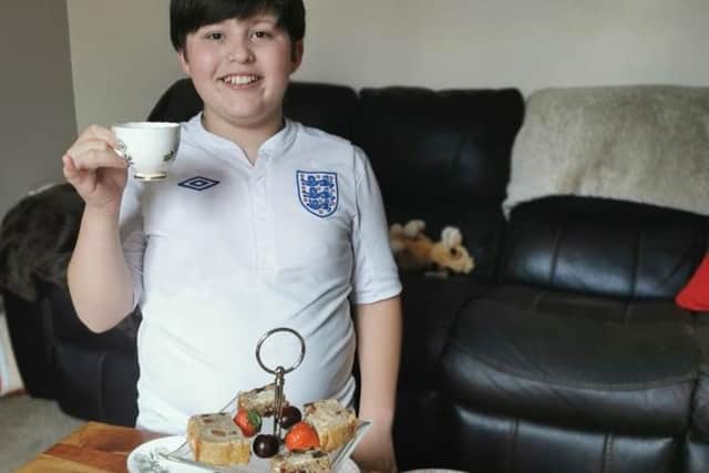 Braden (12) enjoying one of the 200 Afternoon Tea boxes delivered to peoples doors