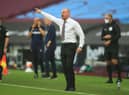 Sean Dyche, Manager of Burnley gives his team instructions during the Premier League match between West Ham United and Burnley FC at London Stadium on July 08, 2020 in London, England. (Photo by Adam Davy/Pool via Getty Images)