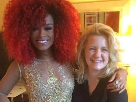 Jenna with singer Fleur East in the dress she designed for her for the Brit Awards.