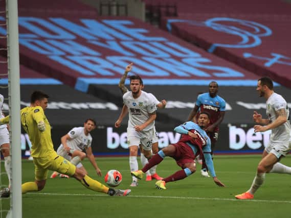 Nick Pope saves from Sebastien Haller at West Ham on Wednesday to preserve his 14th clean sheet of the season