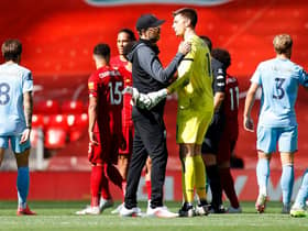 Jurgen Klopp in conversation with Nick Pope at full time at Anfield