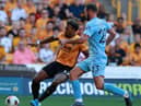 Adama Traore of Wolverhampton Wanderers takes on Erik Pieters during the Premier League match between Wolverhampton Wanderers and Burnley FC at Molineux on August 25, 2019 in Wolverhampton, United Kingdom. (Photo by David Rogers/Getty Images)