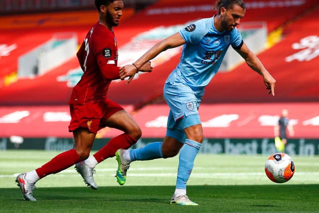 Jay Rodriguez of Burnley shoots and misses during the Premier League match between Liverpool FC and Burnley FC at Anfield on July 11, 2020 in Liverpool, England. (Photo by Clive Brunskill/Getty Images)