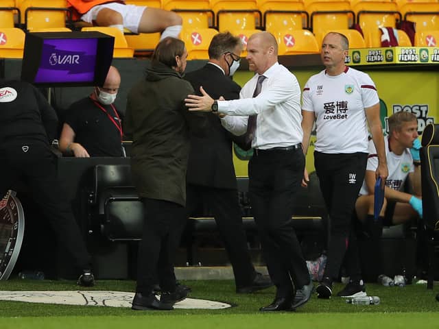 Daniel Farke, Manager of Norwich City and Sean Dyche, Manager of Burnley embrace following the Premier League match between Norwich City and Burnley FC at Carrow Road on July 18, 2020 in Norwich, England. (Photo by Molly Darlington/Pool via Getty Images)