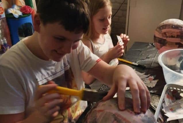 Youngsters in Rosegrove, Burnley pictured hard at work on their models ready for the first scarecrow festival this weekend.