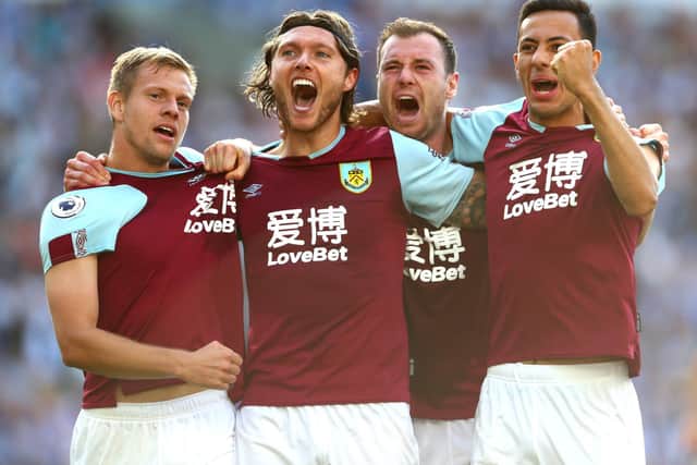 Jeff Hendrick of Burnley celebrates with teammates after scoring his team's first goal during the Premier League match between Brighton & Hove Albion and Burnley FC at American Express Community Stadium on September 14, 2019 in Brighton, United Kingdom. (Photo by Dan Istitene/Getty Images)