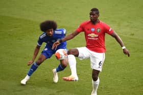 Paul Pogba of Manchester United is challenged by Hamza Choudhury of Leicester City during the Premier League match between Leicester City and Manchester United at The King Power Stadium on July 26, 2020 in Leicester, England. (Photo by Oli Scarff/Pool via Getty Images)