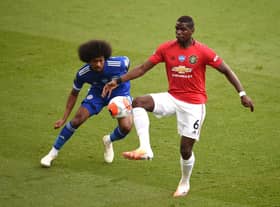 Paul Pogba of Manchester United is challenged by Hamza Choudhury of Leicester City during the Premier League match between Leicester City and Manchester United at The King Power Stadium on July 26, 2020 in Leicester, England. (Photo by Oli Scarff/Pool via Getty Images)