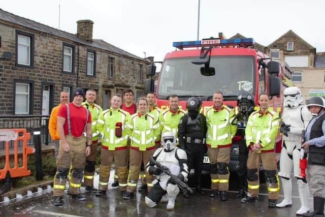 Members of the 5th Legion with firefighters from Padiham