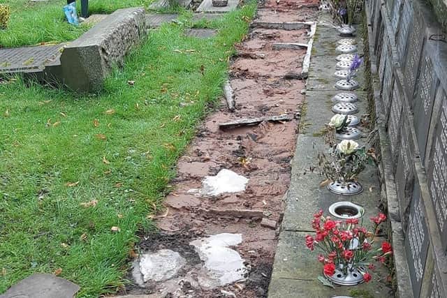 A section of the path where the stones were removed in front of the wall of remembrance at Worsthorne church