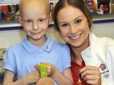 Beautiful and brave Tia Taggart, with Olympian Sophie Hitchon, when she visited St  John the Baptist Primary School in Padiham where Sophie herself was also a former pupil