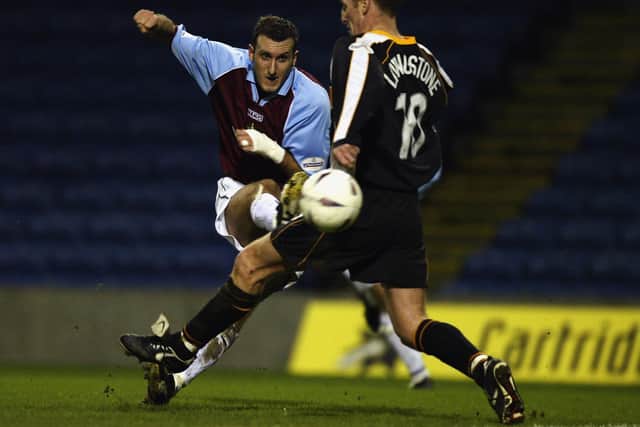 Glen Little of Burnley shoots past Steve Livingstone of Grimsby Town to score the second goal during the FA Cup third round replay match held on January 14, 2003 at Turf Moor, in Burnley, England. Burnley won the match 4-0. (Photo by Alex Livesey/Getty Images)