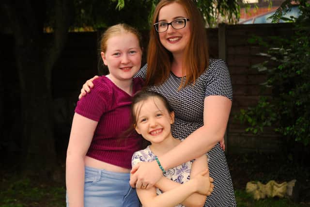 Sarah pictured with her two daughters