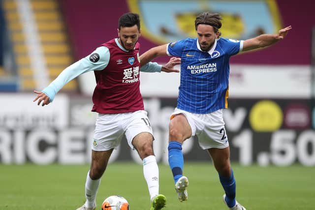 Dwight McNeil of Burnley and Davy Propper of Brighton and Hove Albion battle for the ball during the Premier League match between Burnley FC and Brighton & Hove Albion at Turf Moor on July 26, 2020 in Burnley, England. (Photo by Nick Potts/Pool via Getty Images)