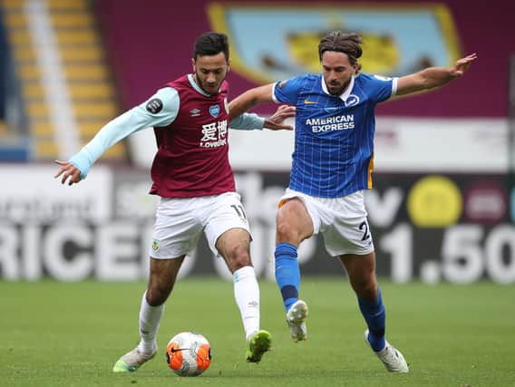 Dwight McNeil of Burnley and Davy Propper of Brighton and Hove Albion battle for the ball during the Premier League match between Burnley FC and Brighton & Hove Albion at Turf Moor on July 26, 2020 in Burnley, England. (Photo by Nick Potts/Pool via Getty Images)