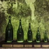 Perhaps size does matter. Heres a jroboam champagne bottle surrounded by other bottle sizes