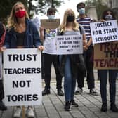 Students wearing face masks take part in a protest in Westminster in London over the government's handling of A-level results, university provision and bleak employment prospects.. Photo credit : Victoria Jones/PA Wire