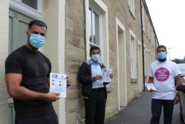 Coun.Ahmed (centre) has played an active role in leafletting campaign encouraging people in Pendle to get tested for Covid 19