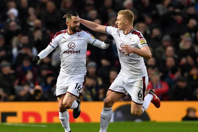 Steven Defour of Burnley celebrates scoring the 2nd Burnley goal with Ben Mee during the Premier League match between Manchester United and Burnley at Old Trafford on December 26, 2017 in Manchester, England. (Photo by Stu Forster/Getty Images)