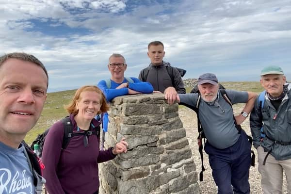 Rory (centre) with family and friends having conquering the Yorkshire Three Peaks