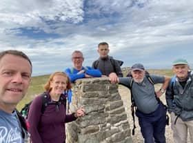 Rory (centre) with family and friends having conquering the Yorkshire Three Peaks