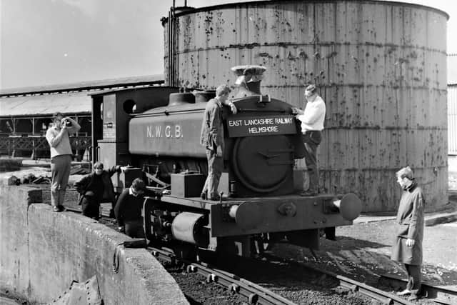 Members of East Lancashire Railway Preservation Society look over "Puffing Billy."