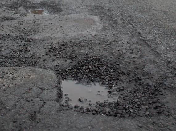 Potholes are currently repaired by Lancashire County Council