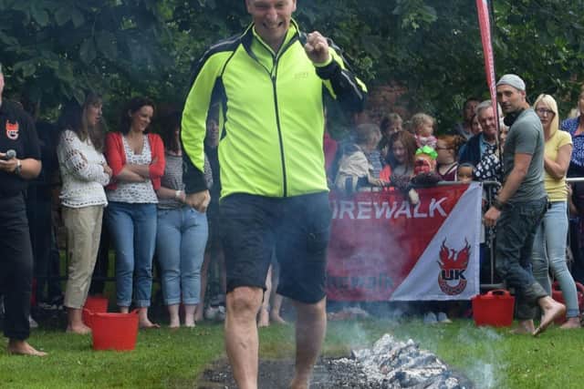 Stephen does a firewalk  to help raise funds for St Catherine's Hospice