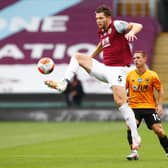 James Tarkowski of Burnley controls the ball during the Premier League match between Burnley FC and Wolverhampton Wanderers at Turf Moor on July 15, 2020 in Burnley, England. (Photo by Jason Cairnduff/Pool via Getty Images)