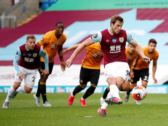 Chris Wood of Burnley scores his sides first goal from the penalty spot during the Premier League match between Burnley FC and Wolverhampton Wanderers at Turf Moor on July 15, 2020 in Burnley, England. (Photo by Clive Brunskill/Getty Images)