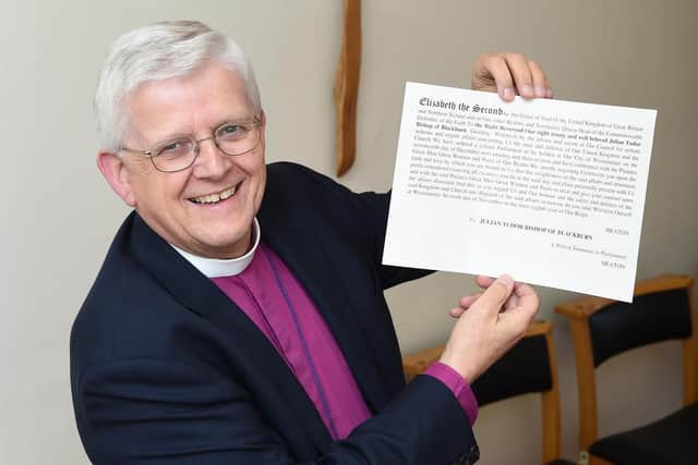 Bishop of Blackburn Rt Rev Julian Henderson with the writ of summons elevating him to the House of Lords