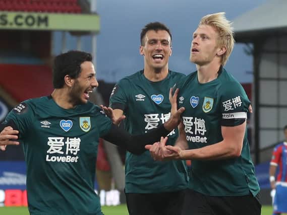 Ben Mee, right, celebrates his winner at Crystal Palace