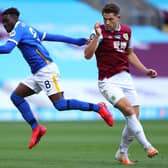 Yves Bissouma of Brighton and Hove Albion controls the ball past James Tarkowski of Burnley during the Premier League match between Burnley FC and Brighton & Hove Albion at Turf Moor on July 26, 2020 in Burnley, England. (Photo by Richard Heathcote/Getty Images)