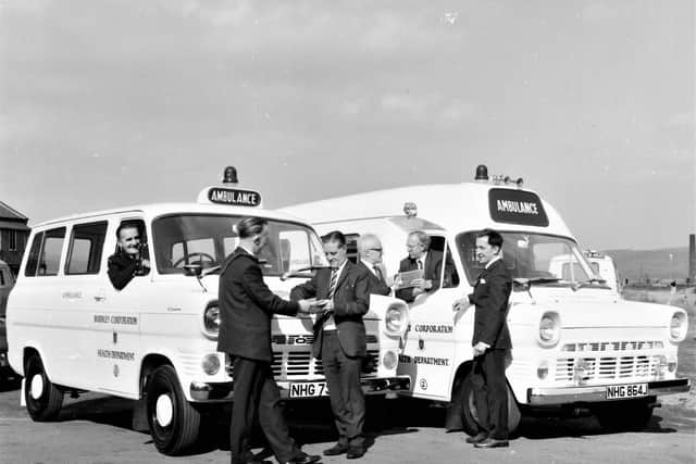 At the handing over are (from the left) ambulance driver Mr. M. McLoughlin, Mr. G.Britnell (from the Blackburn firm which provided the vehicles), Mr. A. Pilling (Chief AdministrationOfficer of the Health department), Dr. E. P. Whittaker (deputy Medical Officer of Health), Mr. F.Margerison (sales manager), and Councillor F. A. Brown.