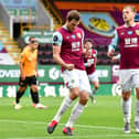 Chris Wood of Burnley celebrates after he scores his sides first goal from the penalty spot during the Premier League match between Burnley FC and Wolverhampton Wanderers at Turf Moor on July 15, 2020 in Burnley, England. (Photo by Paul Ellis/Pool via Getty Images)