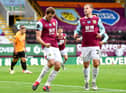 Chris Wood of Burnley celebrates after he scores his sides first goal from the penalty spot during the Premier League match between Burnley FC and Wolverhampton Wanderers at Turf Moor on July 15, 2020 in Burnley, England. (Photo by Paul Ellis/Pool via Getty Images)