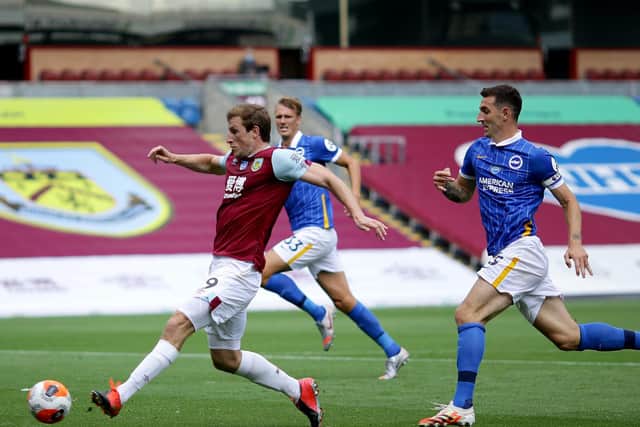 Chris Wood of Burnley scores his sides first goal during the Premier League match between Burnley FC and Brighton & Hove Albion at Turf Moor on July 26, 2020 in Burnley, England. (Photo by Richard Heathcote/Getty Images)