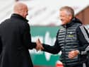 Burnley's Enlgish manager Sean Dyche (L) and Sheffield United's English manager Chris Wilder (R) greet each other for the English Premier League football match between Burnley and Sheffield United at Turf Moor. (Photo by CLIVE BRUNSKILL/POOL/AFP via Getty Images)